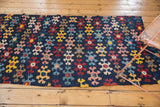Antique Karabagh Kilim runner with staggered geometric motifs and varied color fills.