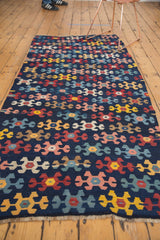 Antique Karabagh Kilim runner's geometric pattern in navy, blush, saffron, and red.