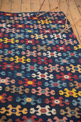Hand woven antique Karabagh Kilim runner with playful geometric patterns in navy, red, yellow, and sky blue.