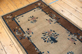 Peking rug detail with ornate cobalt blue vase and pale mauve floral sprays.