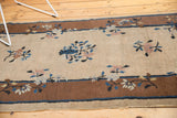 Hand knotted Peking runner's bronze border, pale mauve, cobalt blue floral sprays on beige.