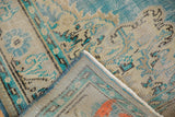 Distressed Oushak rug corner revealing worn pile, visible foundation, and markings on reverse.