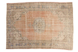 Distressed Oushak carpet with abrashed pale rose field, roundel medallion, European spandrels. 6'10