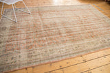 Distressed Oushak rug with faded apricot and sandlewood colors, showing mostly even wear.