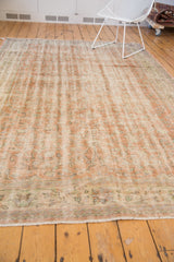Distressed Oushak border revealing worn apricot, ivory, green hues to knot heads.