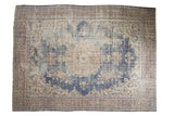 Vintage distressed Oushak carpet, navy medallion, terracotta and ivory floral field, 7'7