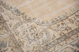 Distressed Sparta rug texture with even wear, visible foundation, ivory, and dusty ocean green.