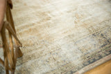 Distressed texture of vintage Oushak carpet with worn pile, visible knot heads, and soft tones.