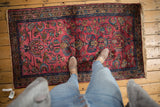 Traditional hand knotted Lilihan rug with delicate floral vinery and raspberry red.