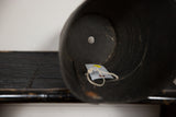 Dark textured interior of the recycled rubber basket planter with drainage hole.