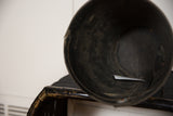 Inside view of the recycled tire rubber basket planter, highlighting its dark texture and signs of use.