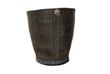 Dark grey recycled rubber tire basket planter featuring visible treads, stitching, and metal rivet.