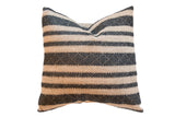 Onyx Black and Natural Pillow with textured geometric and solid horizontal stripes.