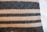 Textured onyx black geometric stripe pattern on the natural reclaimed remnant pillow.