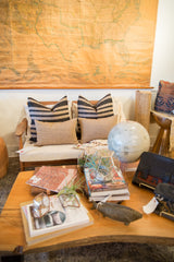 Pair of rectangular striped black and natural jute woven pillows.