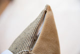 Pillow zipper detail, contrasting black dotted jute fabric with smooth tan faux suede.