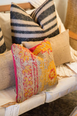 Reclaimed Antique Turkish Rug Fragment Pillow showing textured orange and red weave, bright raspberry red side.