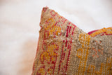 Richly woven texture of orange and raspberry red antique Turkish rug fragment pillow.