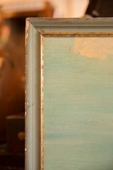 Aged corner of vintage painting, showing chipped frame, gold trim, and blue tones.