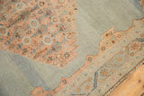 Dusty blush Herati motif on a slate blue field in a vintage Malayer carpet.