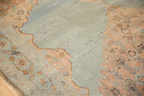 Intricate dusty blush Herati motif and abrash on the distressed slate blue field of a Malayer rug.