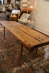 Reclaimed wooden table top with rustic texture, natural grain, and visible imperfections.