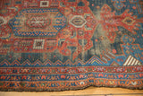 Antique Kurdish Hamadan rug edge showing cherry red, navy geometric patterns and mostly even wear.