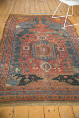 Worn fringe and multiple red borders of antique Kurdish Hamadan rug, muted navy field.