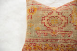 Hand-knotted pile texture with geometric red and orange tribal patterns.