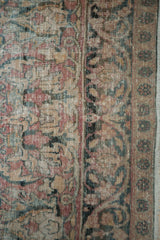 Professionally restrung foundation and worn knot heads in the floral pattern of a Kermanshah carpet.
