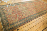 Antique Persian runner with a low pile and a grand Herati pattern in harmonious colors.