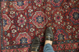 Even pile and fine weave of a vintage Lilihan rug showing lattice medallions in fuchsia and teal.