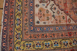 Unusual saffron gold, madder red, and navy borders with intricate floral motifs.