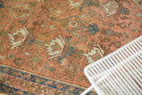 Distressed hand-knotted Malayer rug pile, featuring unidirectional plants in terra cotta, seafoam.