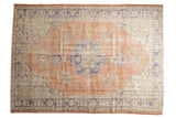 Vintage Distressed Oushak carpet with faded scalloped medallion, pale red, blue, ivory.