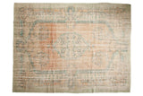 Distressed Oushak rug, blush and mint medallion, ivory field, low shorn pile.