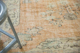 Distressed Oushak rug detail: sandlewood field, arts and crafts potted plant motifs.