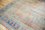 Vintage Distressed Oushak carpet showing mostly even wear to foundation, faded blue and red.