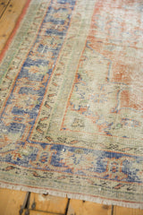 Distressed Oushak texture, with mostly even wear, faded royal blue and pale red.