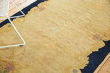 Peking rug detail of pale beige field with dusty gold arts and crafts border.