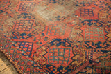 Antique Ersari carpet corner featuring cochineal red triple gul motif, indigo, and fringe.
