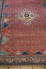 Angled detail of the vintage Serbend's zigzag border and boteh field with low pile.