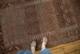 Antique Kurdish runner's intricate checkered floral motif in lattice and playful border design.