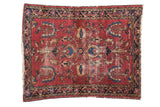 Vintage Lilihan rug, cherry red field, palmette medallion, blossomed trees, navy, gold motifs.