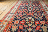 Vintage Malayer runner's intricate Henna plant motif in navy, tangerine, and ivory.
