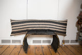 Onyx black and natural striped woven pattern on the XL lumbar pillow.