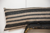 XL lumbar pillow with natural and onyx black geometric striped fabric.