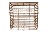 Antique French iron wine rack with aged, rusty brown patina and wavy bottle supports.