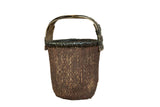 Black Chinese Willow Basket with rustic, dark woven texture and arched handle.