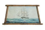 Vintage seascape painting of a sailing ship on blue waves, framed in wormwood.